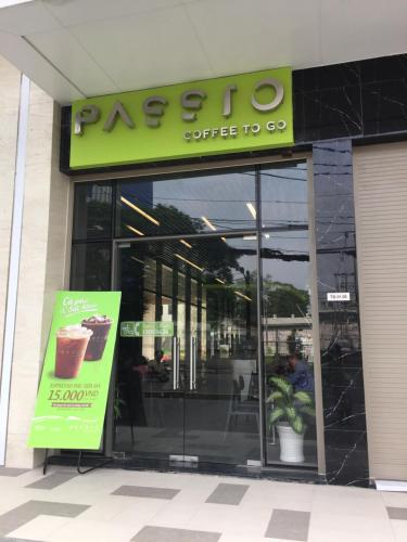 a coffee shop with a sign in the front of it at Kirakuan Luxury 2BR Pool/Gym in Ho Chi Minh City