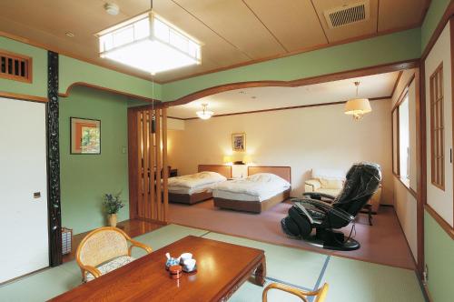 Postel nebo postele na pokoji v ubytování Watarase Onsen Hotel Sasayuri