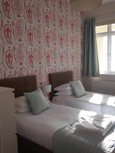 Postel nebo postele na pokoji v ubytování Astor House