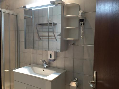 a bathroom with a sink and a mirror at Haus Heimo in Bad Kleinkirchheim