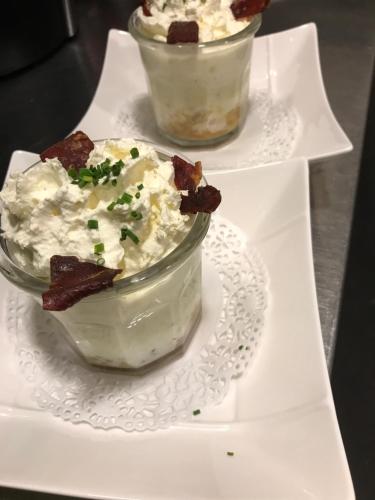 two dishes of potato salad on a white plate at Logis Hôtel Restaurant de la Paix in Lodève