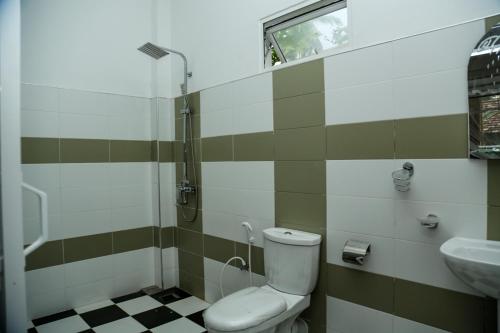 Ένα μπάνιο στο One-plus Holiday Homes Mirissa