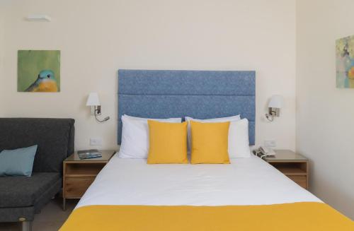 Ένα ή περισσότερα κρεβάτια σε δωμάτιο στο Americana Eilat Hotel