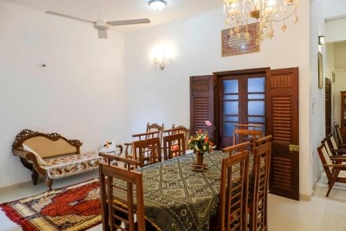 a dining room with a table and chairs at Southern Comforts - Galle Fort in Galle