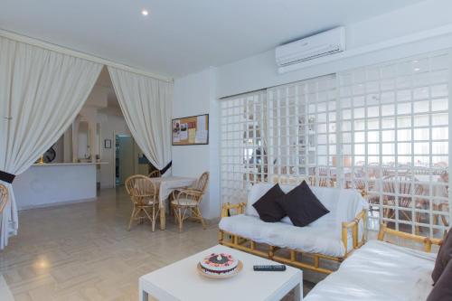 a living room with a couch and a table at Hotel New York in Cervia