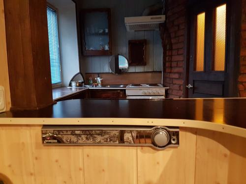 a kitchen with a wooden counter top in a kitchen at Apartament Erfolg 6 in Daugavpils