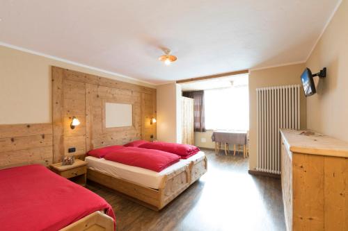 Säng eller sängar i ett rum på Hotel Champagne