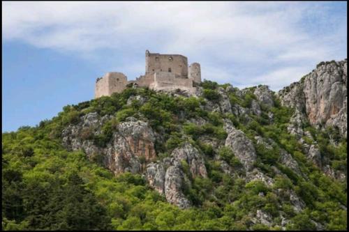 a castle on the top of a mountain at Holiday home Marija in Vrlika