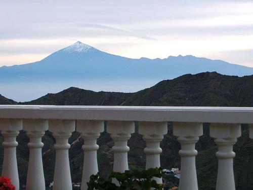 a balcony with a view of a mountain at Casas Rurales El Serrillal in Hermigua