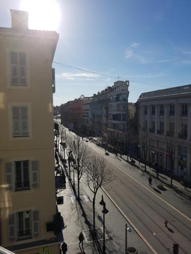 a view of a street in a city with buildings at Résidence Appartement Adonis in Nice
