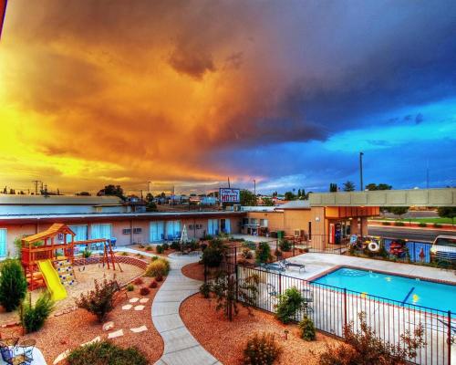 a view of a resort with a pool and a playground at Lake Powell Canyon Inn in Page