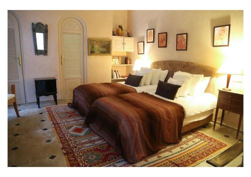a bedroom with a large bed in a room at La Maison de Tanger in Tangier