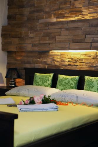 a bedroom with a bed with flowers on it at Apartments Vila ViDa Orebić in Orebić