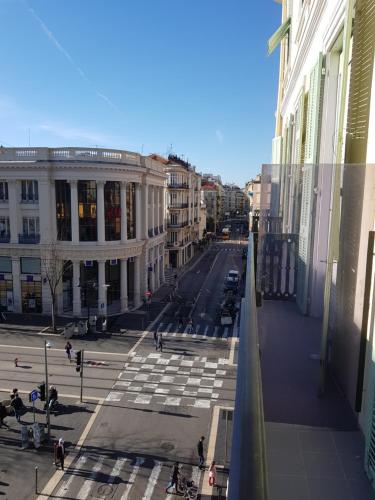 a view of a city street with people and buildings at Résidence Appartement Adonis in Nice