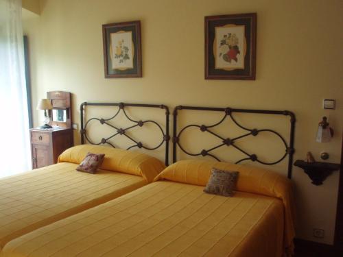 Giường trong phòng chung tại Casa De Vacaciones La Rivera