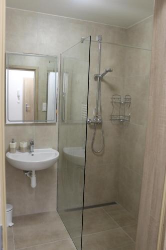 a bathroom with a shower and a sink at Apartment Lúčky - Jasná in Demanovska Dolina