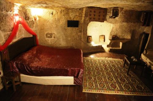 Postel nebo postele na pokoji v ubytování Kapadokya Ihlara Konakları Otel Antik Konaklar