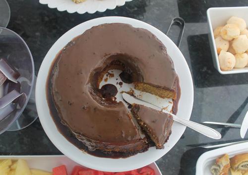 a chocolate cake in a bowl on a table at Pousada Orquideas de Maria in Aparecida