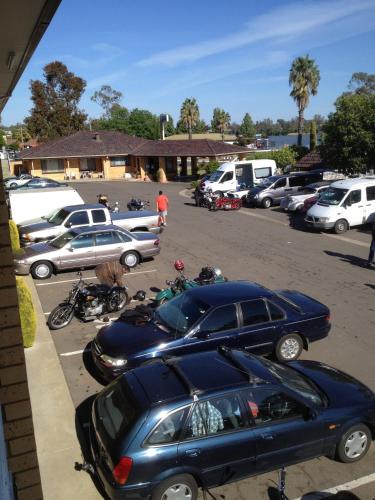 a group of cars parked in a parking lot at Lakeview Motel in Yarrawonga