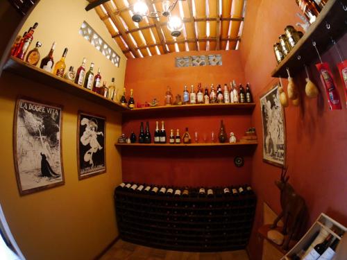 a bar with a bunch of bottles of alcohol at Pousada do Capão Chapada Diamantina in Vale do Capao