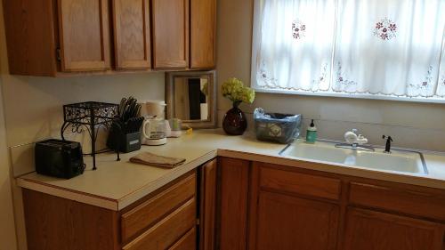 a kitchen counter with a sink and a window at Lovely Smarthome King HDTV AC WIFI ❤ of Downtown in Klamath Falls