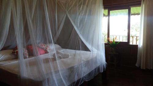 Katil atau katil-katil dalam bilik di Posada Villa Margarita
