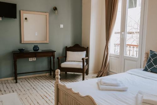 Un pat sau paturi într-o cameră la Faidra