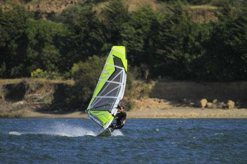 a man is windsurfing on a body of water at Arenaguas Beach House in Matanzas