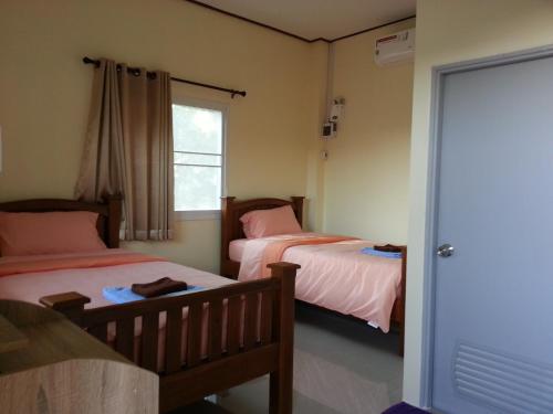 Ліжко або ліжка в номері Queue&Bright Resort