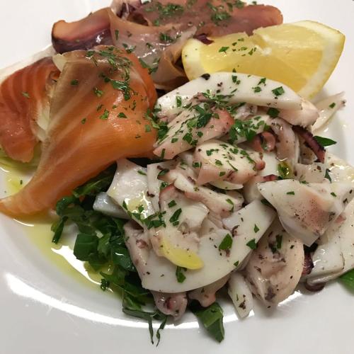 a plate of shrimp and vegetables on a white plate at Domus Hotel in Bagnoli del Trigno