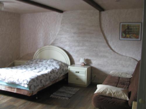 Ένα ή περισσότερα κρεβάτια σε δωμάτιο στο Usadba v Paperne