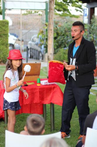 a man and a little girl standing next to a table at Residence Borgomare in Albenga