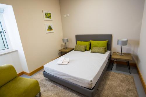 Ένα ή περισσότερα κρεβάτια σε δωμάτιο στο Desafios da Horta