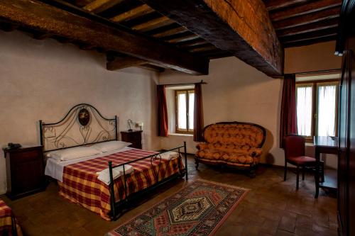 A bed or beds in a room at Hotel La Corte