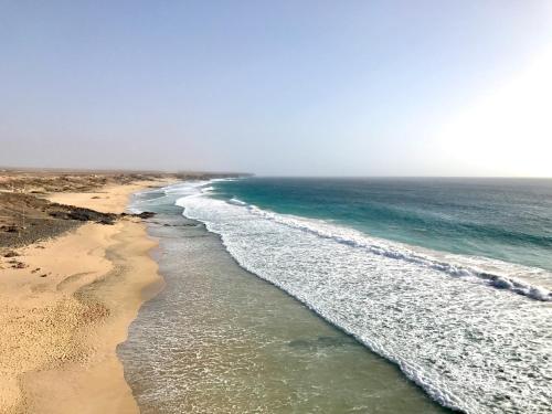 an aerial view of a beach with the ocean at Casa Natalie in El Cotillo