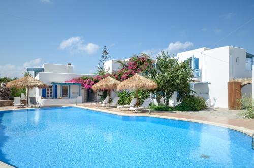 a swimming pool in front of a villa at Aggeliki's Diamond in Agia Anna Naxos