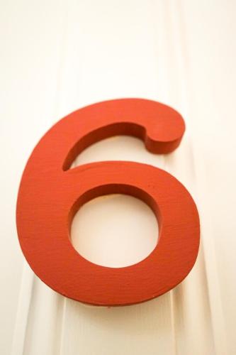a red number on a white curtain at Azores Dream Hostel in Ponta Delgada