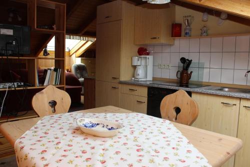 a kitchen with a table with a bowl on it at Haus Koblizek in Waldkirchen