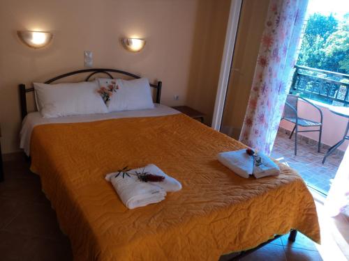 Postel nebo postele na pokoji v ubytování Maistralis House