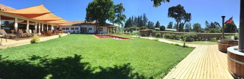 a yard of a house with a pool in it at Hotel Boutique BC Wine Casablanca in Casablanca