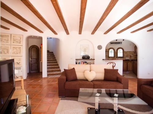 a living room with a couch and a table at Holiday Home Luz y Paz by Interhome in Altea la Vieja