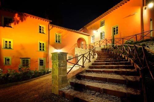 a set of stairs leading to a building at night at Agriturismo Villa Le Vigne in Montevarchi