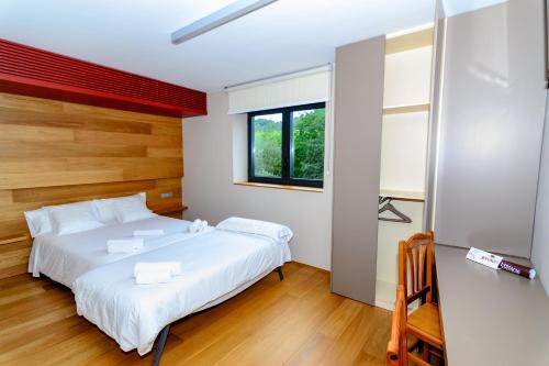 Llit o llits en una habitació de Hotel Estació
