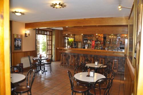 The lounge or bar area at Hotel Tres Arcos