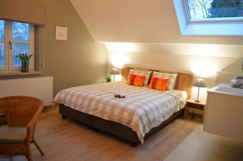 En eller flere senge i et værelse på Maison Margriet