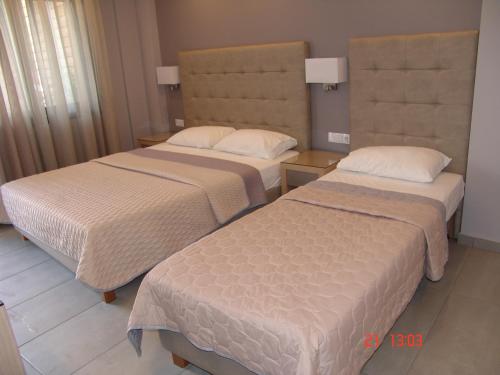 Ένα ή περισσότερα κρεβάτια σε δωμάτιο στο Il Mondo Residence