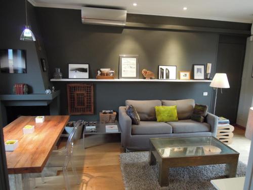 a living room with a couch and a table at Penthouseinrome in Rome