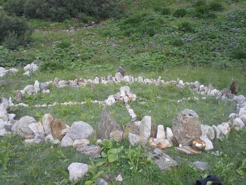 a pile of rocks in a field of grass at Saghäusl in Mitterkleinarl