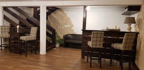 a living room with a table and some chairs at Galikowo in Płaska