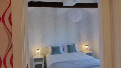 Ένα ή περισσότερα κρεβάτια σε δωμάτιο στο Casa del Maestro